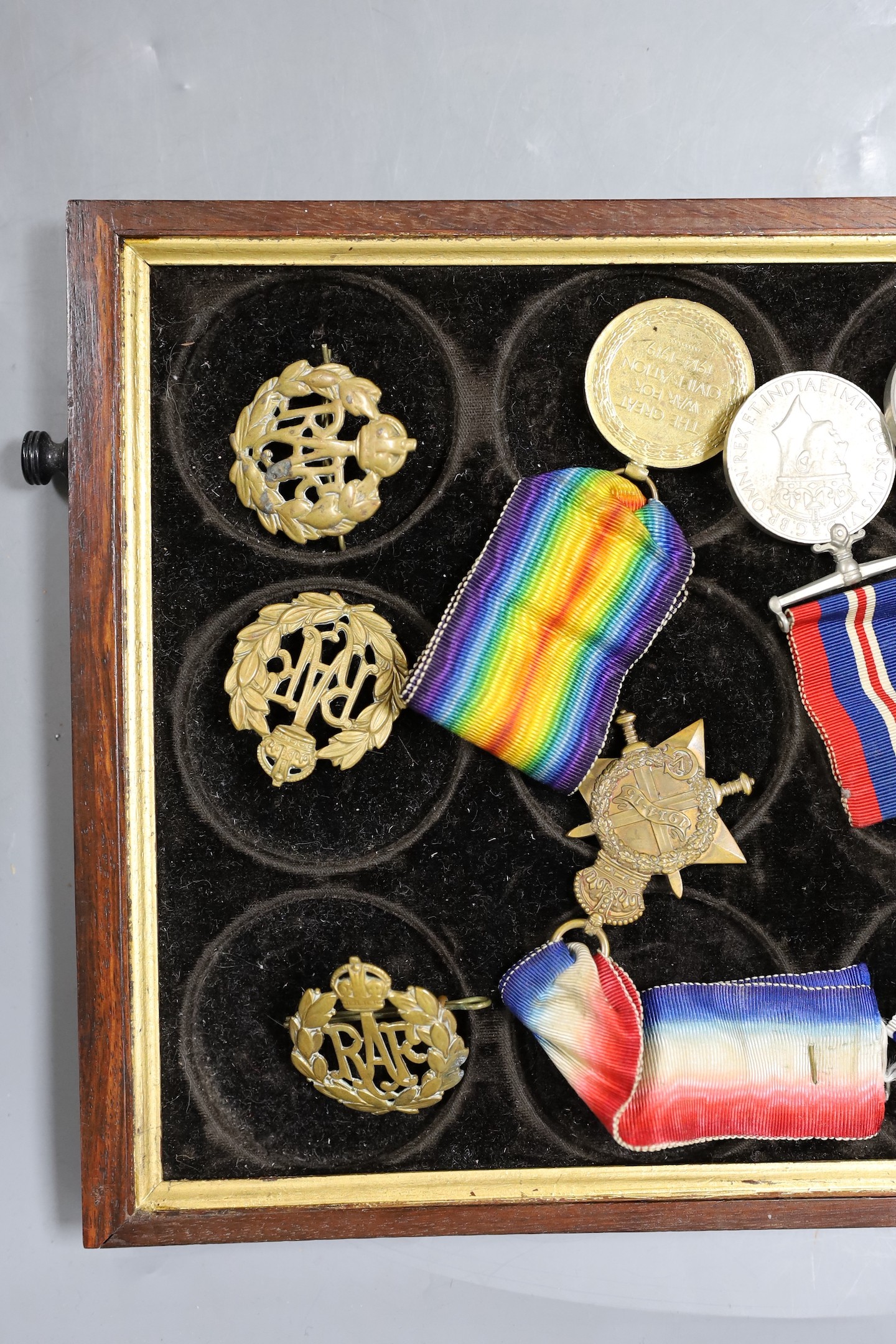 A WWI to Elizabeth II family medal group including WWI trio GSM with Borneo clasp, QEII Police medal etc